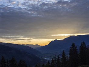 Sunset over the Eisenerz Alps, mountain massif Reiting, in the Liesingtal the village Traboch, view