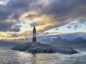 Lighthouse Faro Les Eclaireurs at sunset, dramatic clouds, Beagle Channel, Tierra del Fuego, Tierra