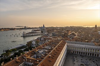St Mark's Square and Basilica di Santa Maria della Salute on the Grand Canal at sunset, view from