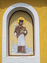 Image of a figure of a saint, fresco on a wayside cross, near St.Andrae-Hoech, Sausaler Weinland,