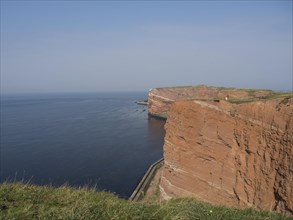 Impressive red cliffs on the coast with sea view, Heligoland, Germany, Europe