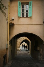 Tunnel Below Building in Old Town with People in Antibes, Cote d'azur, France, Europe