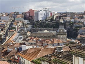 A city view with many red roofs and historic buildings in the background, historic buildings and