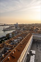 St Mark's Square and Basilica di Santa Maria della Salute on the Grand Canal at sunset, view from