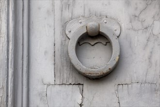 Door knocker on an old wooden door, Rome, Italy, Europe