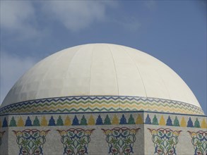 White dome with colourful mosaics and blue sky in the background, Dubai, Arab Emirates