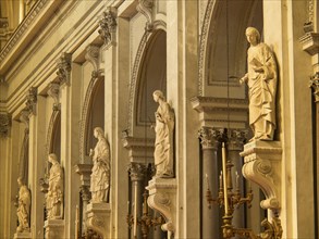Detailed statues in a baroque church with golden elements and a sacred atmosphere, palermo in