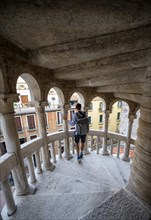Young man on the spiral staircasePalazzo Contarini del Bovolo, Palace with spiral staircase,