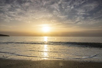 Sunrise over the sea, view into the Atlantic. on the beach of Tarajalejo on Fuerteventura, Canary