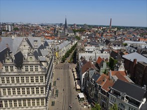 Panoramic view of a historic city centre with many old buildings and towers on a clear summer day,