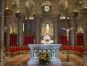 Religious interior with altar, crucifix and decorative chairs, Monte Carlo, Monaco, Europe
