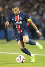 Football match, captain Kylian MBAPPE' Paris St Germain on the ball with his head down looking at