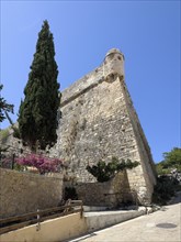One of ten 10 round watchtowers on south-east side of ruins of historical fortress Fortetza