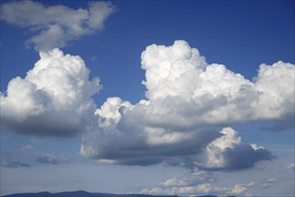 Large cumulus clouds over the mountains of the Bavarian Forest near Deggendorf, Lower Bavaria,