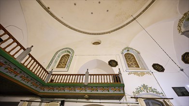Retzep Pasha Mosque, interior of a mosque with ornate interior decoration, wooden balustrade and