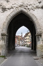 View through the Obertor, historic town gate along Marktstrasse to the Blaserturm tower in the old