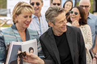 Cannes, France, 19.5.2024: Sharon Waxman and Willem Dafoe in front of talking about the new film
