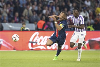 Football match, captain Kylian MBAPPE' Paris St. Germain left in a duel for the ball with Kevin