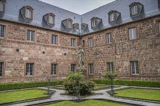Inner courtyard with figure of St Odilia, Hohenburg Monastery, Odilienberg, Alsace, France, Europe