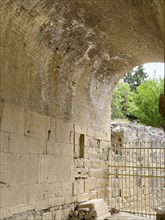 Wall of archway behind amphitheatre carved written chiselled laws City law of Gortys carved in