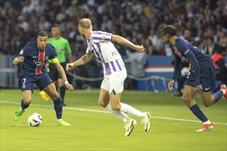 Football match, captain Kylian MBAPPE' Paris St. Germain left on the ball, a player of FC Toulouse