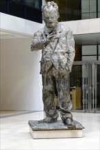 Bronze statue of a man in a modern lobby of a building, Willy-Brandt-Haus, SPD Headquarters,