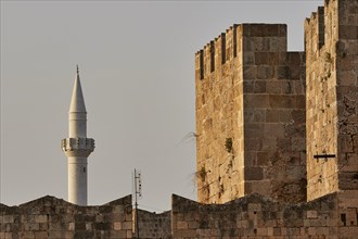 Ibrahim Pasha Mosque, Historic minaret next to an old stone wall at sunset, Rhodes Old Town, Rhodes