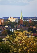 View from the Pluto spoil tip to Wanne-Eickel with the church tower of St Laurentius, Herne, Ruhr