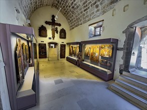 Entrance area with showcases historical icons in museum Monastery museum in UNESCO World Heritage