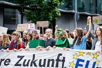 Demonstrators with signs at Fridays for Future, taken during the climate strike for the EU
