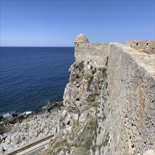 One of ten 10 round watchtowers on north side of ruins of historical fortress Fortetza Fortezza of