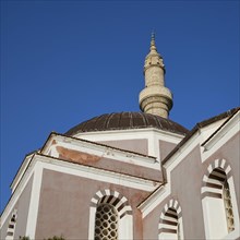 Suleiman Mosque, close-up of a mosque with dome and minaret, decorative windows and blue sky,