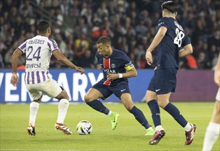 Football match, captain Kylian MBAPPE' Paris St. Germain right on the ball, Cristian CASSERES Jr.
