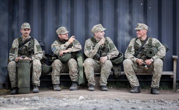 Young Lithuanian reserve soldiers take a lunch break during their training, taken in Rudninkai,
