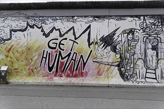 Graffiti on the Berlin Wall in the East Side Gallery, Berlin, Germany, Europe, A comic-like