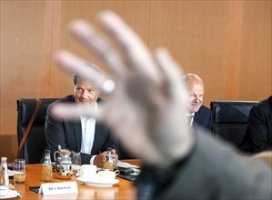 Federal Chancellor Olaf Scholz, right, at the beginning of the cabinet meeting with Federal