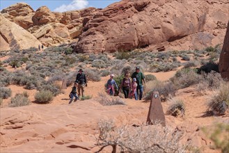 Family of hikers on the Fire Canyon Triin at Valley of Fire State Park near Overton, Nevada, United
