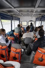 Tourists on a taxi boat, Corcovado National Park, Costa Rica, Central America