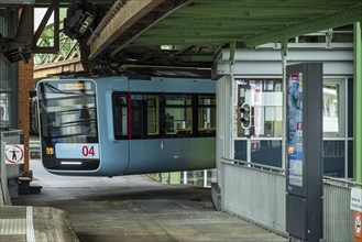 A blue suspension railway turns at the Wuppertal Vohwinkel terminus