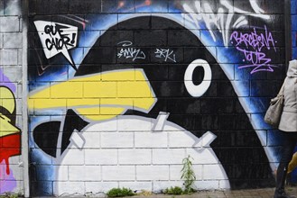 Barcelona, Catalonia, Spain, Europe, Graffiti of a penguin with a yellow beak on a wall in