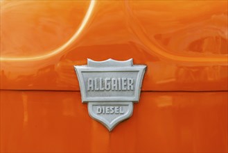 Allgaier Diesel, Porsche tractor, sheet metal logo on orange painted bonnet, Offenbach, Dreieich,