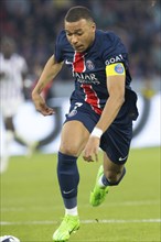 Football match, captain Kylian MBAPPE' Paris St Germain energetically running after and leading the