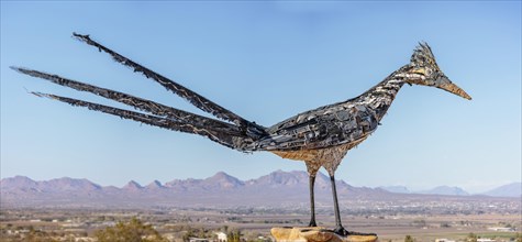 Panorama of Giant Recycled Roadrunner statue made entirely from discarded materials by artist Olin