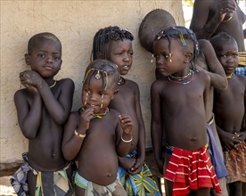 Group of traditional Hakaona children, Angolan tribe of the Hakaona, near Opuwo, Kunene, Namibia,