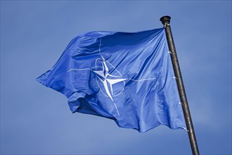 The NATO flag flies on the roof of Palais Czernin during the NATO meeting of foreign ministers