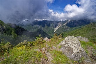 Mountain panorama from Passo Croce in the Garfagnana mountain landscape to the cloudy peaks of the