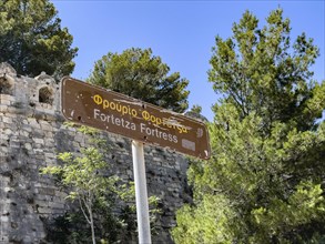 Sign with reference to historical fortress ruins of historical fortress Fortetza Fortezza of