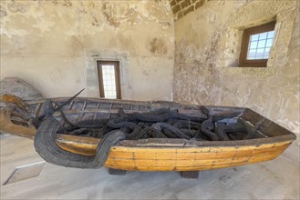 Photo of artwork by Museum of Contemporary Art Refugee boat of migrants and seven snakes made of