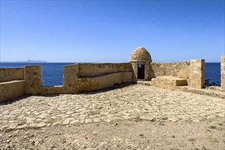 Round watchtower and wall with crenellated gap for guns one of 10 round watchtowers of historic