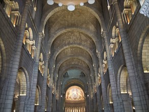 Impressive church interior with stone arches, vaults and ceiling mosaic, Monte Carlo, Monaco,